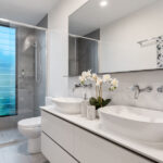 Bathroom designs Light tones make small areas feel larger. Mirrors and glass helps to create a perception of a bigger space. Plants add a natural element to bathrooms.